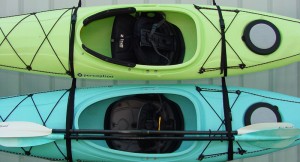 A good example of properly hanged kayaks. Straps are located at 1/3 points (over bulkheads) and kayaks are on edge.
