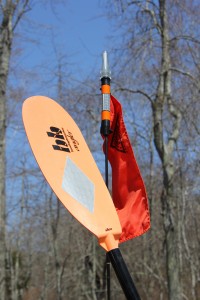 Orange Flags and bright colored paddles with retroreflecttive tape can help increase your visibility to passing boaters